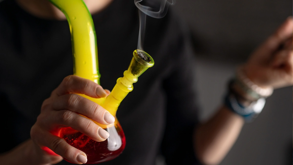 smoking infused flower in a bong