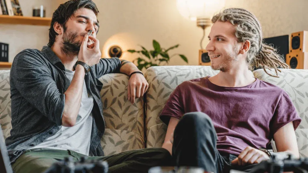 two guys smoking cannabis and waiting for edibles to kick in